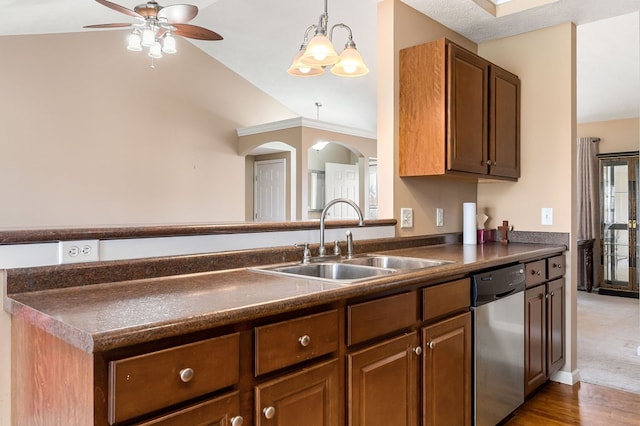 kitchen featuring dark countertops, ceiling fan, brown cabinets, stainless steel dishwasher, and a sink