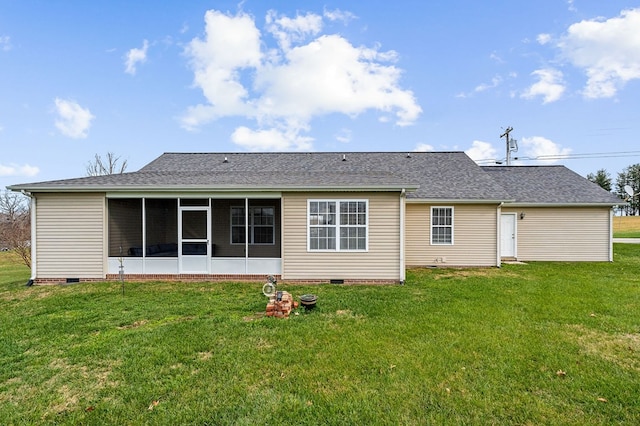 rear view of property with a yard, roof with shingles, crawl space, and a sunroom