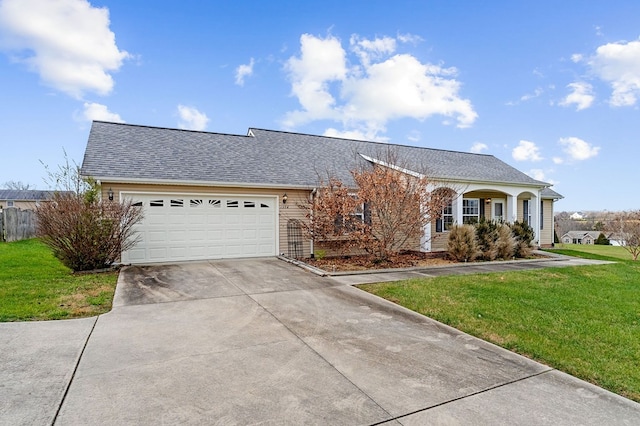 view of front of property featuring a shingled roof, an attached garage, driveway, and a front lawn