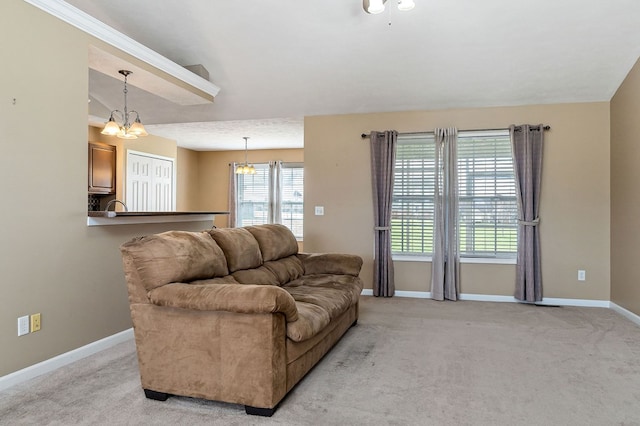 living room with vaulted ceiling, light colored carpet, a notable chandelier, and baseboards