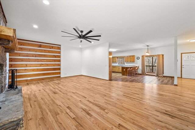 unfurnished living room with recessed lighting, ceiling fan, and light wood finished floors