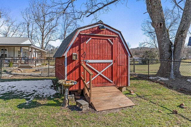 view of shed featuring fence