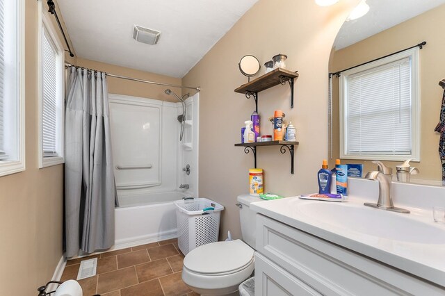 full bathroom with toilet, vanity, shower / bath combination with curtain, and visible vents