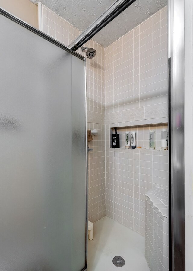 bathroom featuring a stall shower