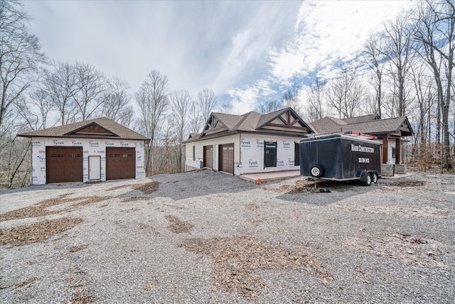 unfinished property with a garage