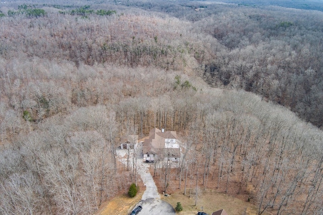 drone / aerial view featuring a forest view