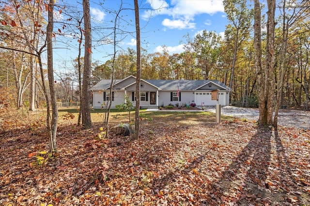 ranch-style home with driveway and an attached garage