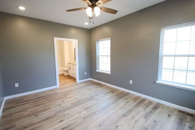 unfurnished bedroom with light wood finished floors, recessed lighting, visible vents, and baseboards