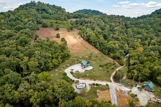 aerial view featuring a wooded view