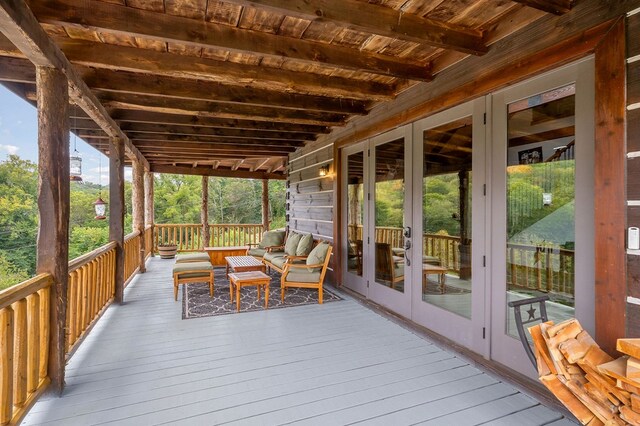 wooden deck with french doors and an outdoor living space