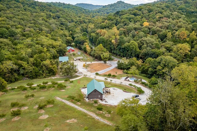 birds eye view of property with a wooded view