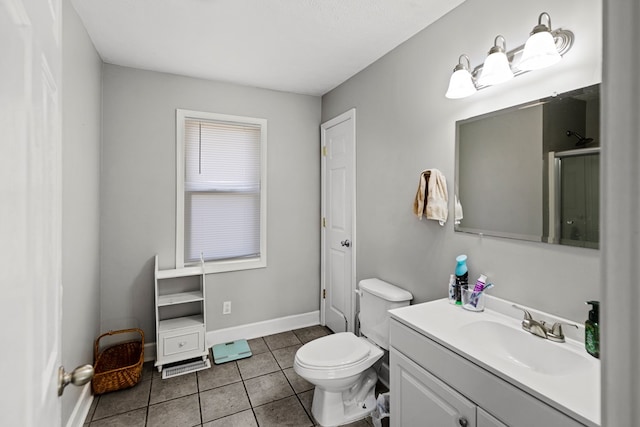 full bathroom featuring toilet, a closet, vanity, and tile patterned floors