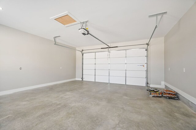 garage featuring baseboards and a garage door opener