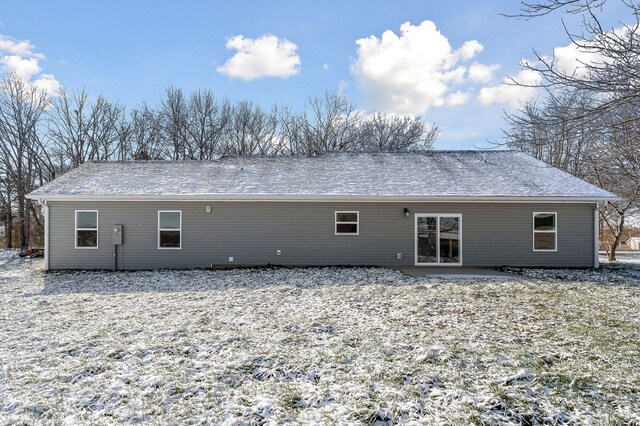 view of snow covered house