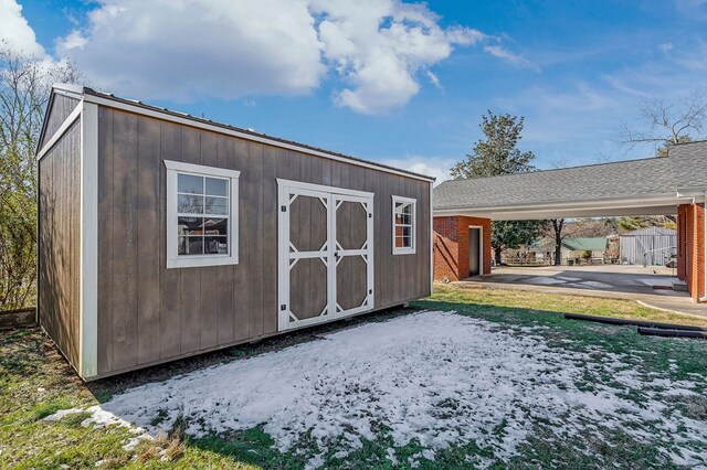 view of shed featuring a carport