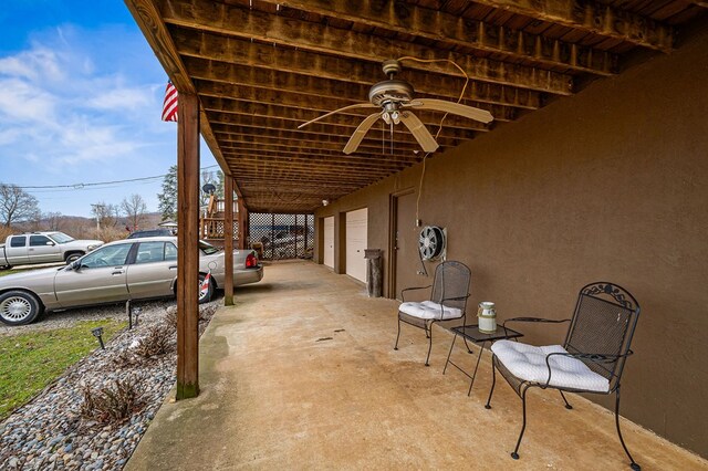 view of patio / terrace featuring a garage