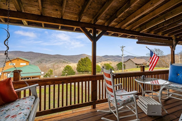 wooden terrace featuring a mountain view