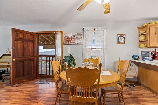 dining room featuring a ceiling fan and light wood-style floors