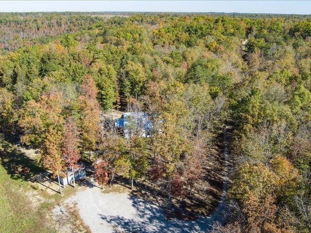 drone / aerial view with a view of trees