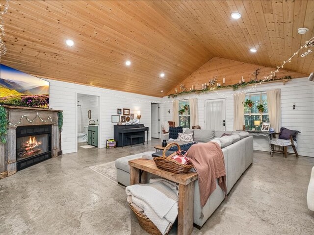 living area with lofted ceiling, a lit fireplace, wood ceiling, and recessed lighting