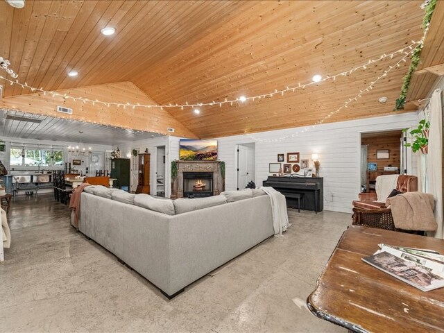 living room featuring lofted ceiling, visible vents, wood ceiling, a chandelier, and a lit fireplace