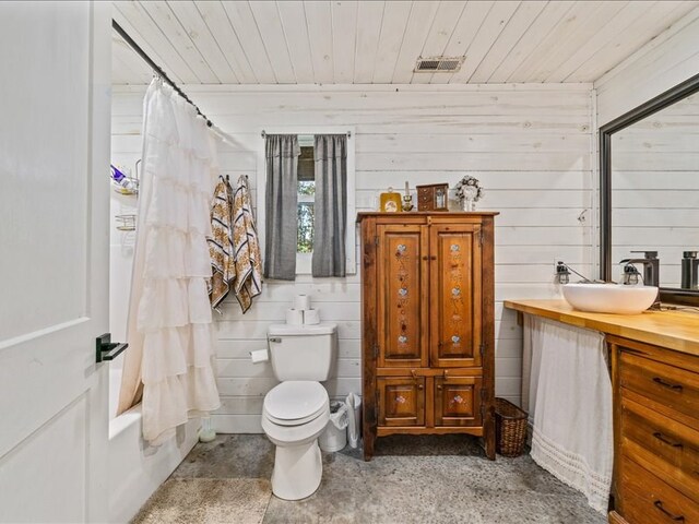 full bath with visible vents, toilet, shower / bath combo, wood ceiling, and vanity