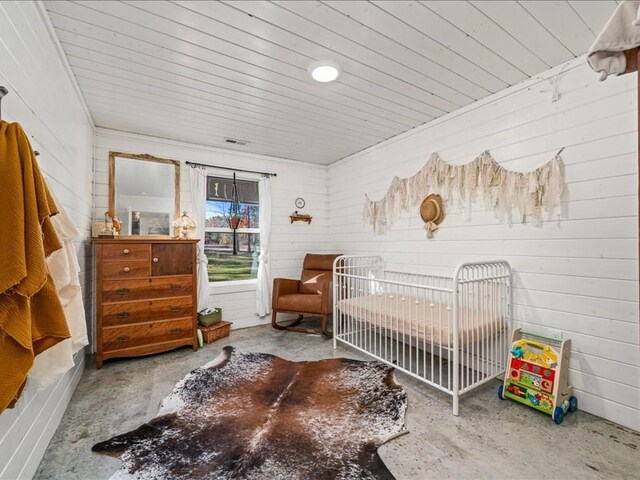 bedroom featuring concrete floors