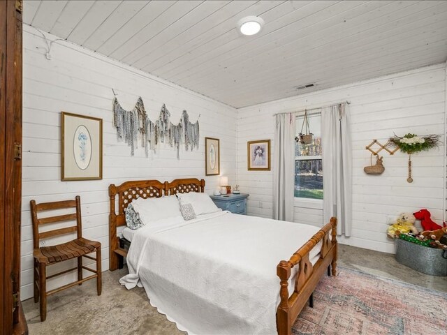 carpeted bedroom with wooden ceiling