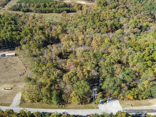 drone / aerial view with a view of trees