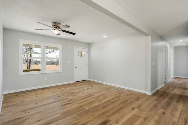 entrance foyer with light wood-type flooring and baseboards