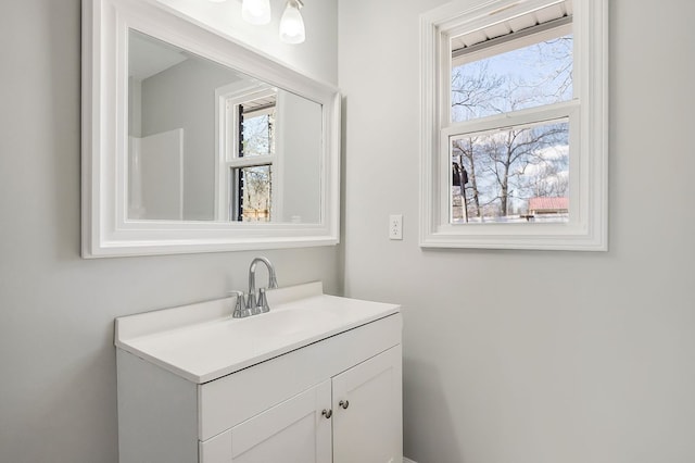 bathroom featuring a wealth of natural light and vanity