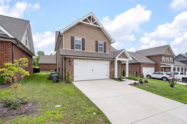 view of front of house with driveway, brick siding, an attached garage, and a front yard