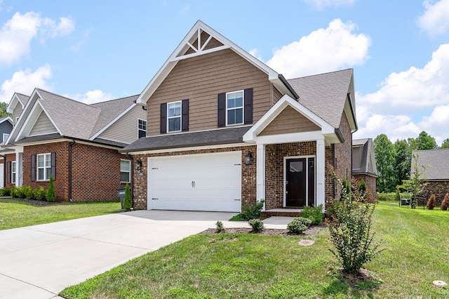 craftsman-style house featuring a garage, driveway, brick siding, and a front yard