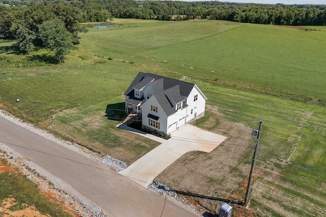 birds eye view of property with a rural view