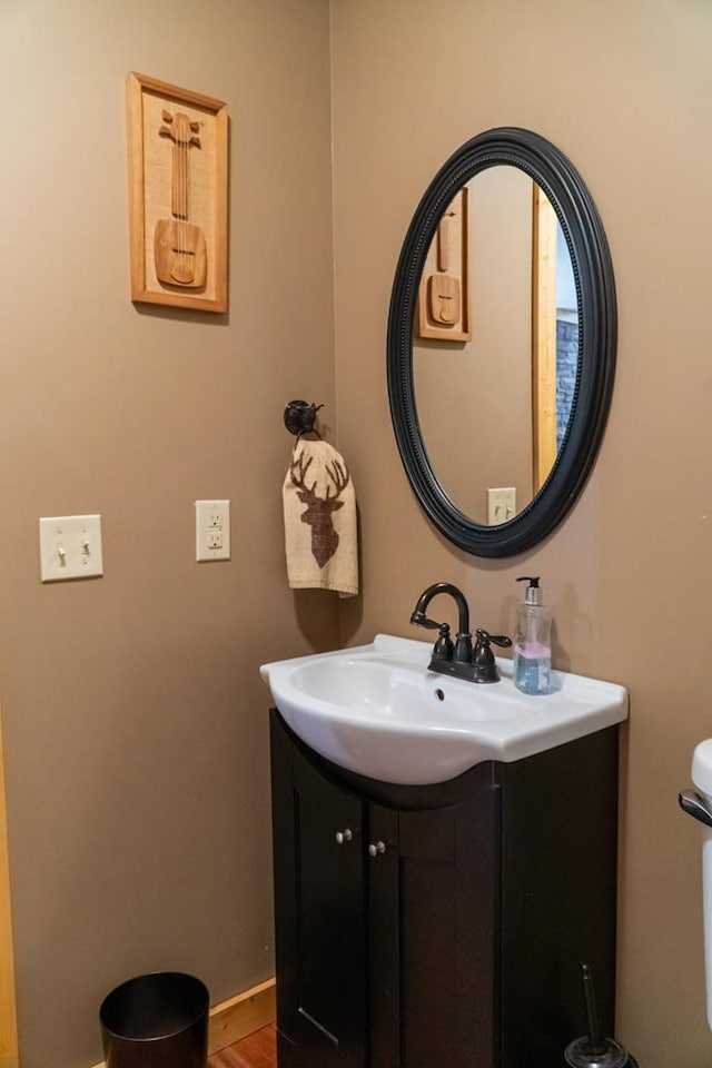 bathroom featuring vanity and baseboards