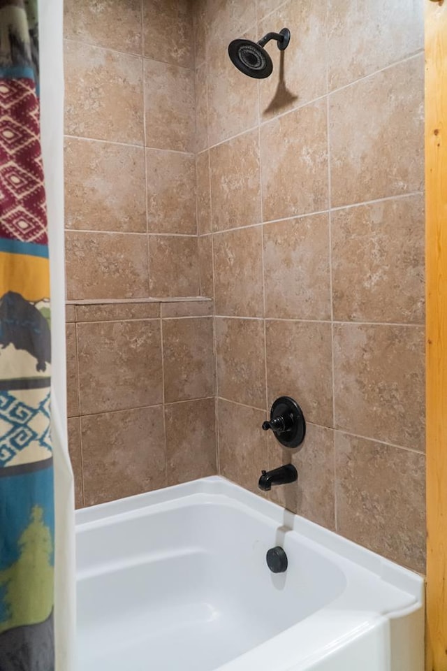 bathroom with shower / bath combo