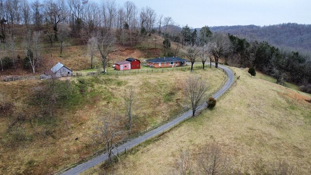 birds eye view of property with a rural view and a forest view