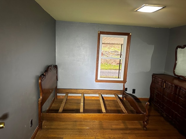 bedroom featuring wood finished floors