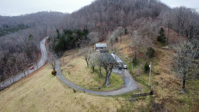 birds eye view of property with a rural view and a view of trees