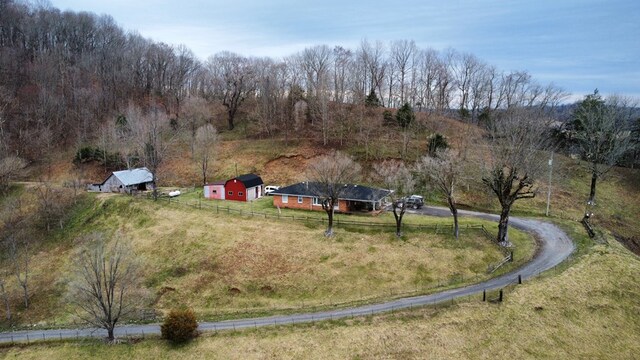 birds eye view of property with a rural view