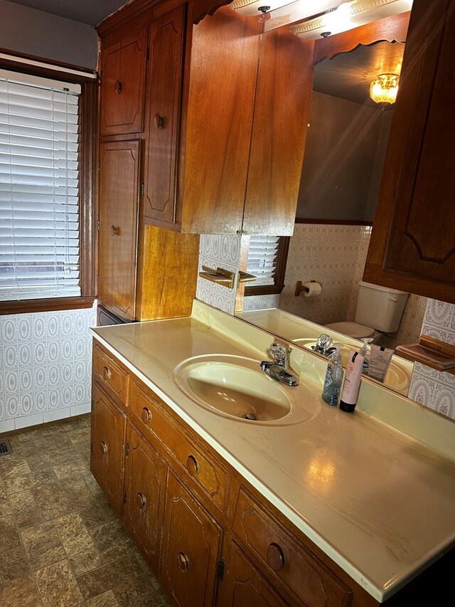 bathroom featuring vanity and toilet