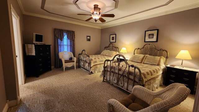 bedroom featuring ornamental molding, carpet flooring, and a ceiling fan