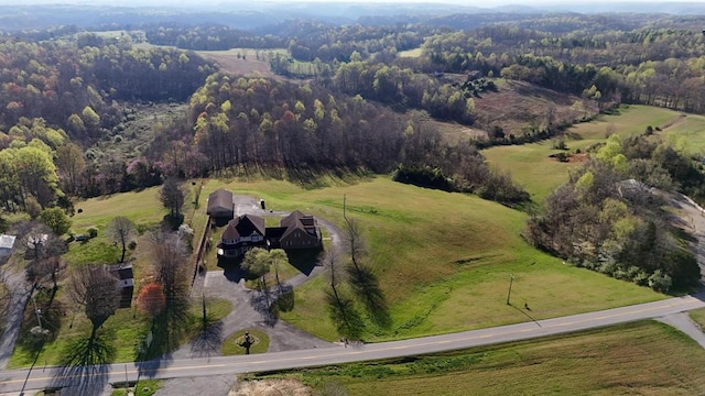 birds eye view of property featuring a rural view and a forest view