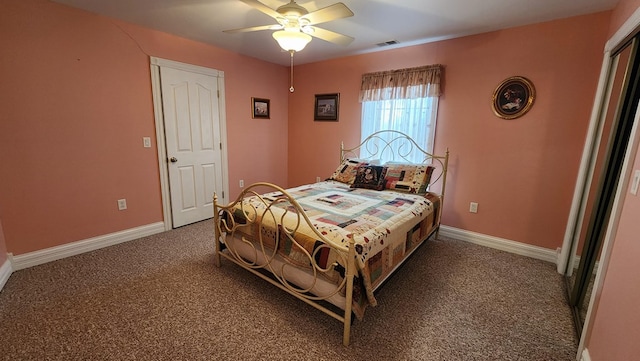 bedroom with carpet, visible vents, baseboards, and ceiling fan