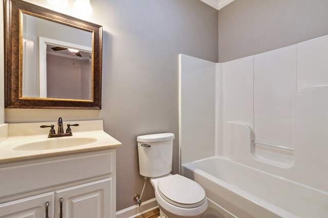 full bath with baseboards, vanity, and toilet