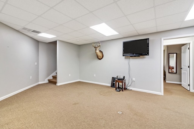 basement with carpet floors, stairway, and baseboards