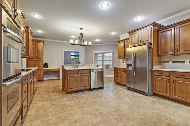 kitchen featuring stainless steel appliances, a sink, light countertops, and brown cabinets