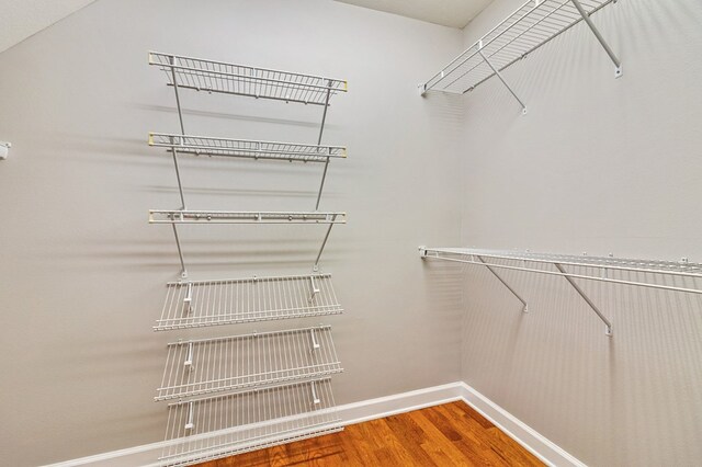 spacious closet with wood finished floors