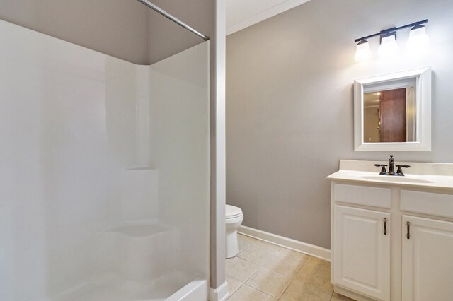 full bathroom featuring walk in shower, tile patterned flooring, vanity, and baseboards