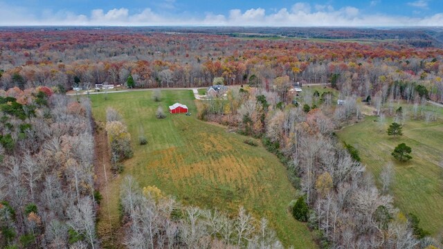 bird's eye view with a rural view and a wooded view